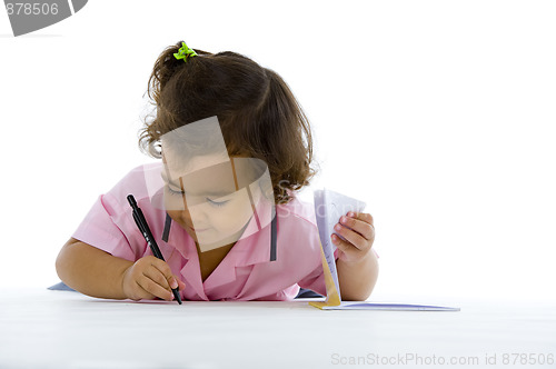 Image of cute girl writing