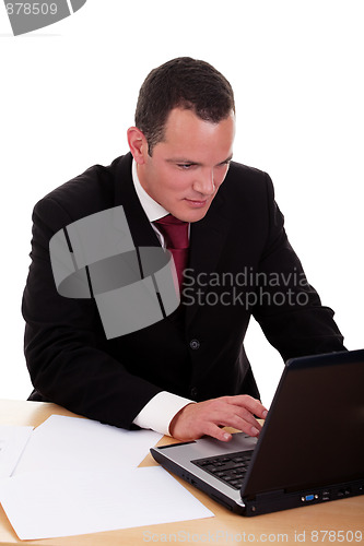 Image of businessman   looking to computer
