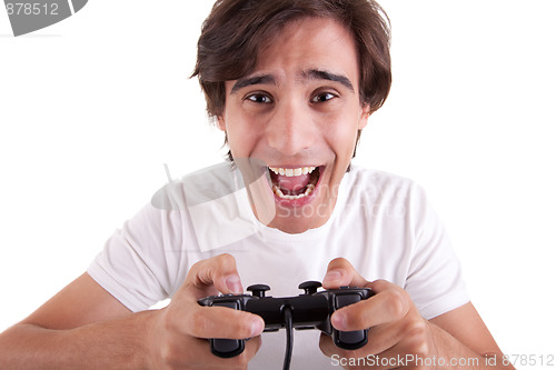 Image of Handsome man, playing with gamepad