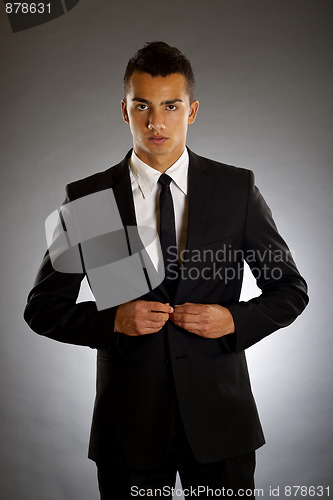 Image of businessman buttons up