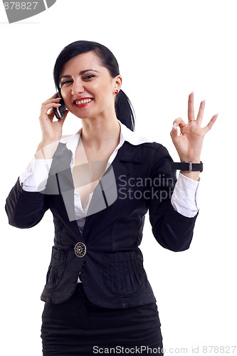 Image of  businesswoman on the phone winning