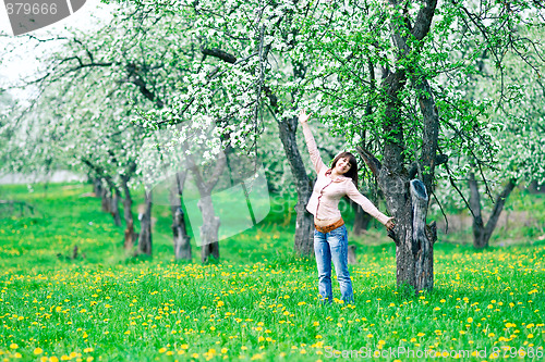 Image of Cheerful woman in the garden