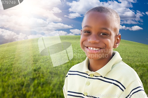 Image of Handsome African American Boy Over Grass and Sky