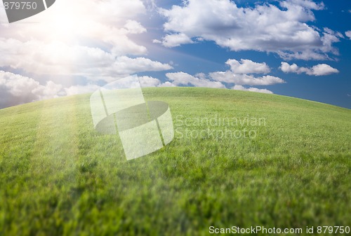 Image of Green Grass Field, Blue Sky and Sun