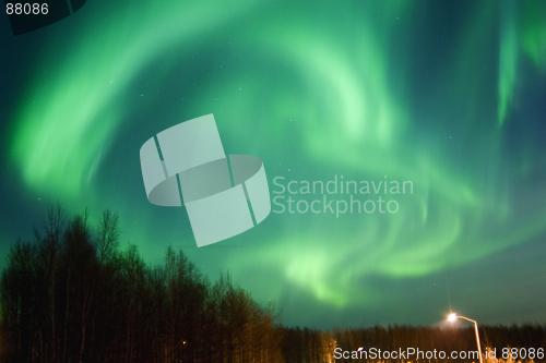 Image of Round aurora over townlights