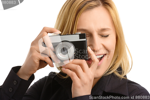 Image of young woman taking a shot with photo camera