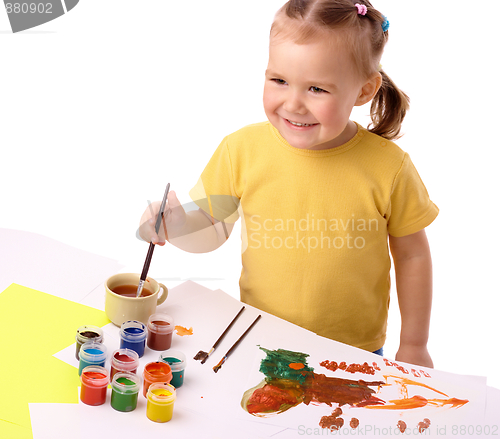 Image of Cute child play with paints