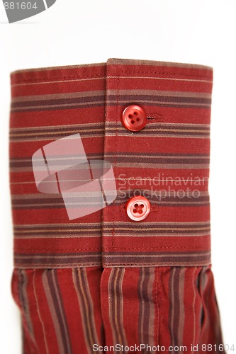 Image of red cuff from striped shirt