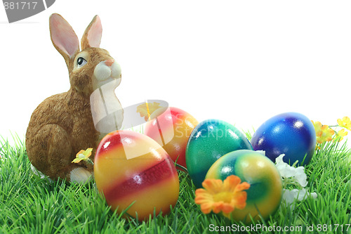 Image of Easter bunny with eggs on a lawn