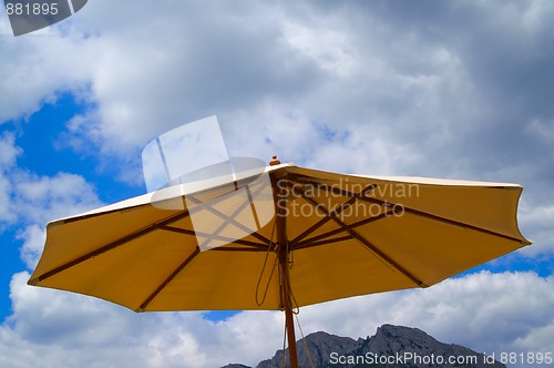 Image of Sunshade against the rocks and sky