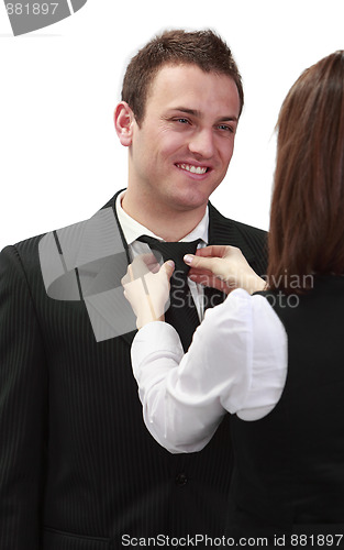 Image of Woman Tying Man's Tie