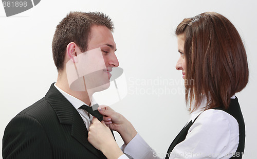 Image of Woman Tying Man's Tie