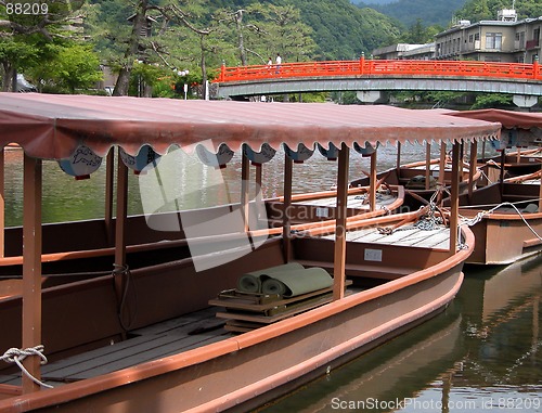 Image of Boats and traditional bridge