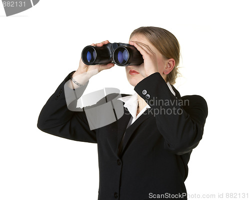 Image of young business woman looking through binoculars