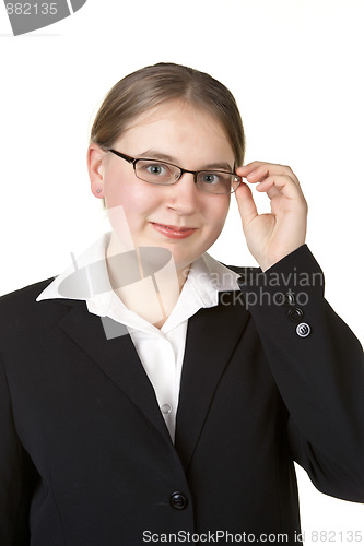 Image of young business woman adjusting glasses 