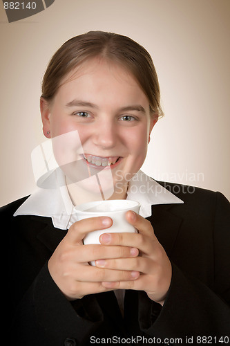 Image of young business woman with coffee 