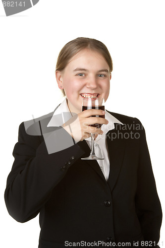 Image of young business woman with glass of wine 
