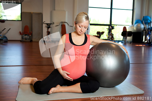 Image of Pregnant woman doing relaxation exercise