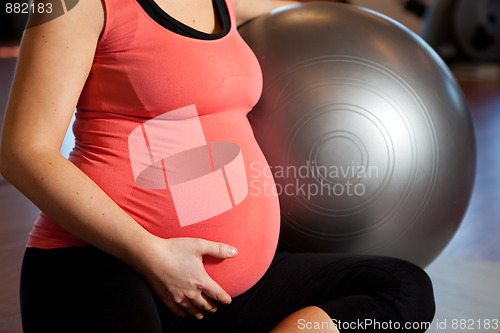 Image of Pregnant woman doing relaxation exercise