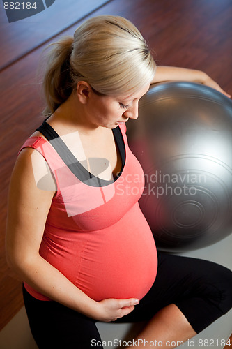 Image of Pregnant woman doing relaxation exercise