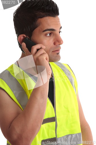Image of Tradesman on phone looking sideways