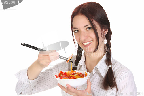 Image of Beautiful woman eating with chopsticks