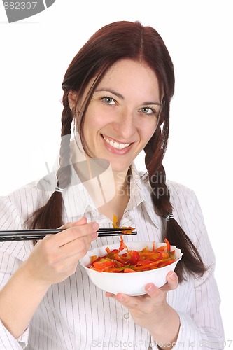 Image of Beautiful woman eating with chopsticks