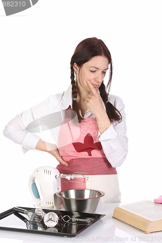 Image of beautiful housewife preparing