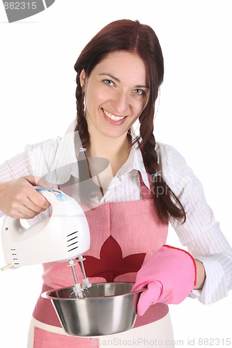 Image of housewife preparing with kitchen mixer