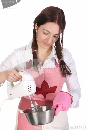 Image of housewife preparing with kitchen mixer