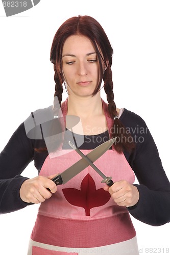 Image of housewife sharpening a knife