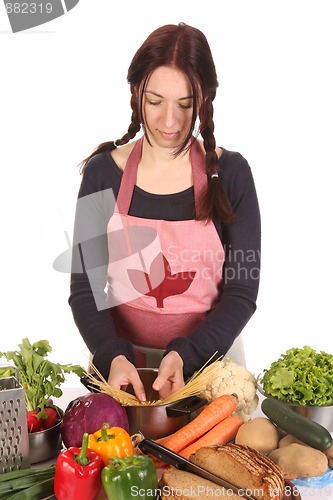 Image of beautiful housewife preparing