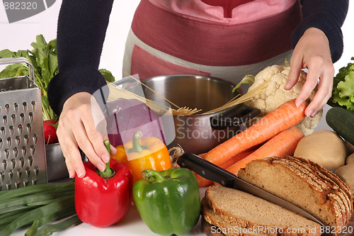 Image of housewife preparing with diversity a food