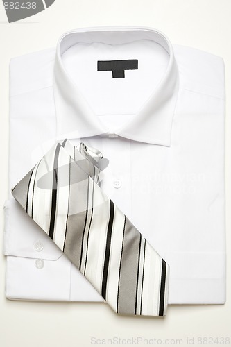 Image of classic white shirt and striped tie