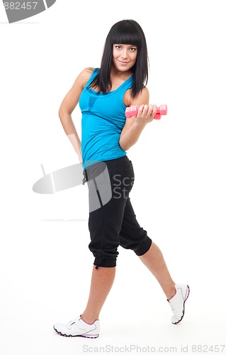 Image of Fitness instructor stand with dumbbells