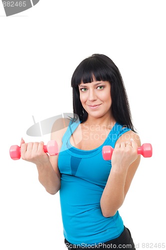 Image of Happy young woman with dumbbells