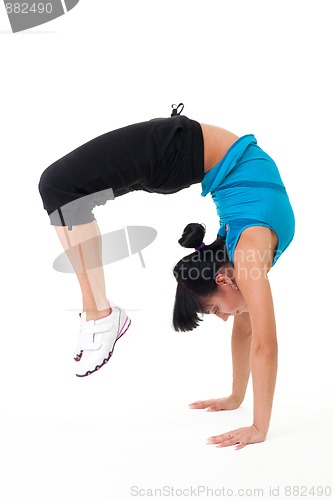 Image of Woman standing on her hands