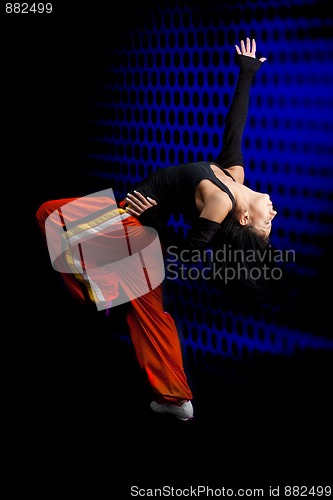 Image of Dancer performing on dark background