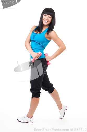 Image of Fitness instructor posing with dumbbells