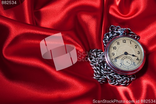 Image of Old clock on red background