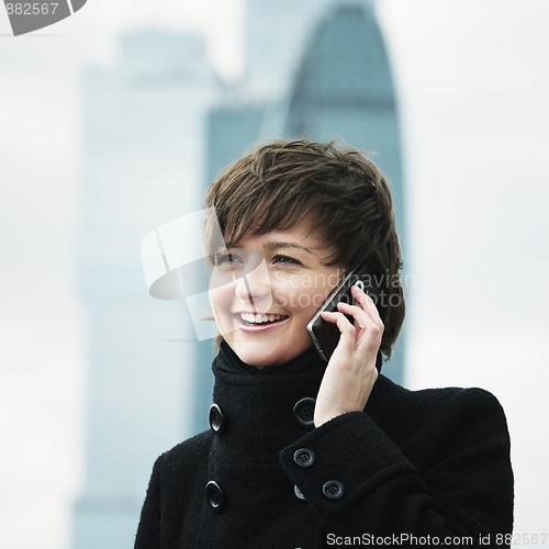 Image of Smiling woman on cellphone