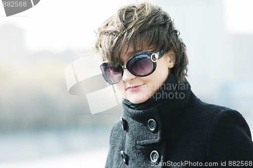 Image of Young woman in sunglasses