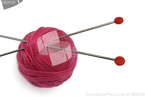 Image of Red clew and knitting needles