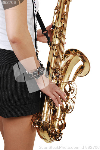 Image of Chinese girl playing the saxophone.