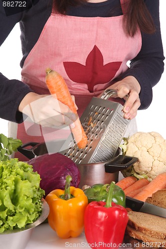 Image of cutting carrot with stainless grater