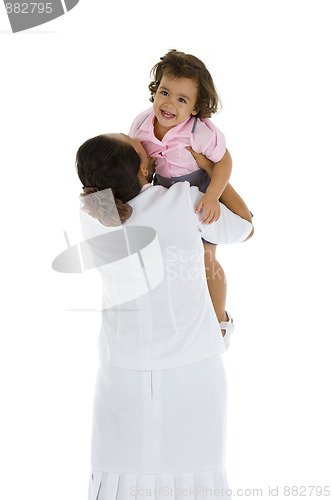 Image of woman holding a happy girl