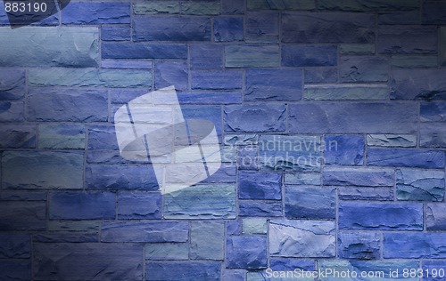 Image of Blue masonry wall lit diagonally