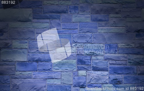 Image of Blue masonry wall lit dramatically