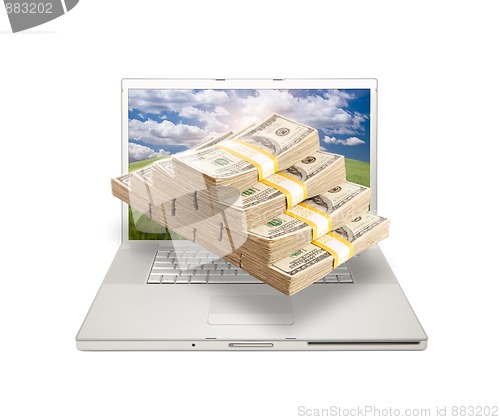 Image of Laptop with Stacks of Money Coming From Screen