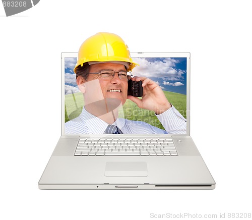 Image of Laptop and Man with Hard Hat on Cell Phone